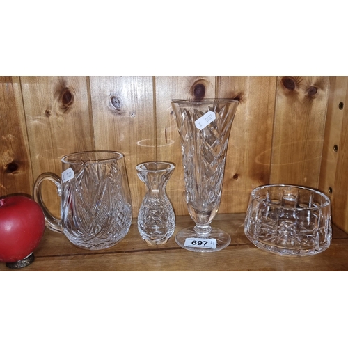 697 - Collection of Waterford Crystal items, including a pitcher, two vases, a footed vase, and a small bo... 