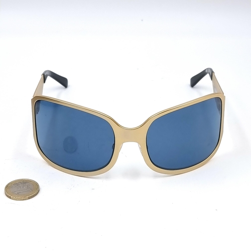 503 - A pair of gold toned Eley-Kishimoto sunglasses marked 'Eley Kishimoto' EK#G3 on frame. Lenses in goo... 