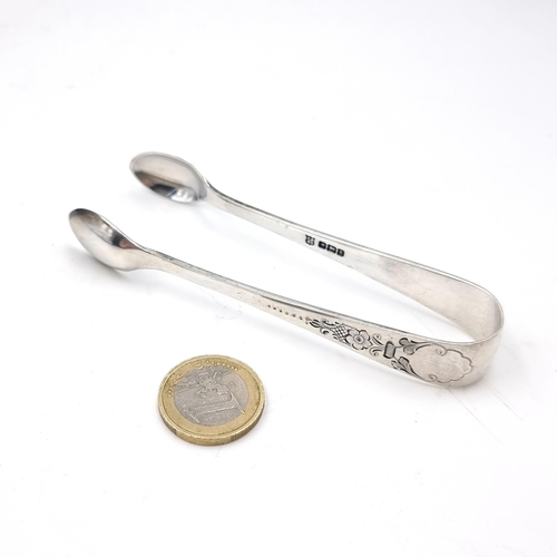 505 - A pair of vintage sugar tongs set in sterling silver hallmarked Sheffield circa 1915. Length - 11 cm... 