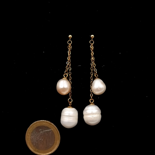 507 - Star Lot : A very pretty pair of 18 carat gold Baroque shaped Akoya pearl drop earrings. Drop - 6.5 ... 