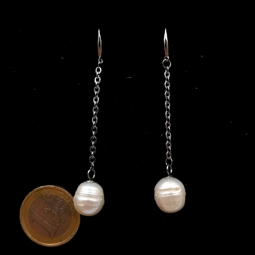 509 - Star Lot : A most gorgeous Baroque shaped pearl drop earrings set in 18 carat white gold. Drop - 5 c... 