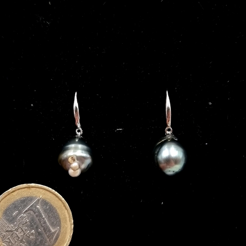 512 - Star Lot : A pretty 18 carat white gold Tahitian pearl drop earrings. Weight - 4.5 grams.