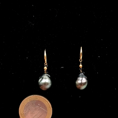 513 - Star Lot : A beautiful 18 carat gold Tahitian pearl drop earrings. Weight - 4.5 grams.