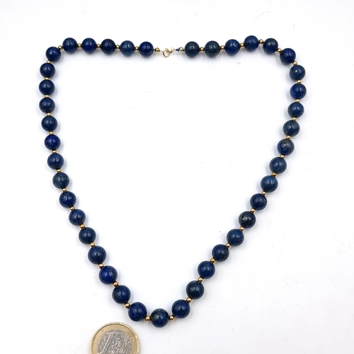 518 - Star Lot : A very pretty 18 carat gold necklace set with Lapis Lazuli stones and 18ct gold beads. Le... 