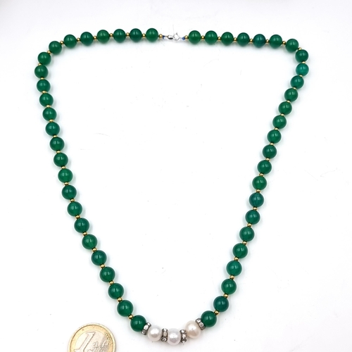 519 - Star Lot : A beautiful 18 carat gold necklace set with jade stones and gold beads. Length of necklac... 