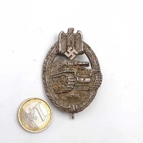 526 - An original  WWII German tank assault badge with pin present at rear. Stamped 