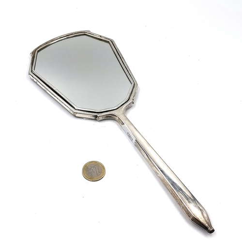 532 - A vintage mid century vanity mirror set in sterling silver. Hallmarks for Birmingham dating to 1953.... 