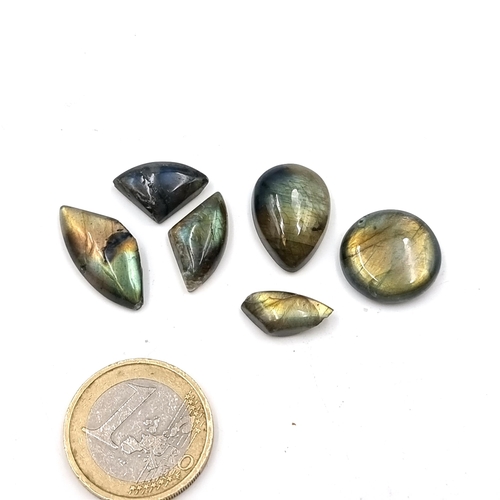 570 - A collection of six cabochon cut labradorite stone of 46 carats.