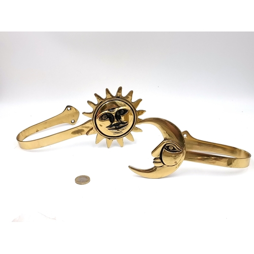 571 - A pair of brass  curtain tie backs in the form of the sun & moon. Most unusual piece. Items as per p... 