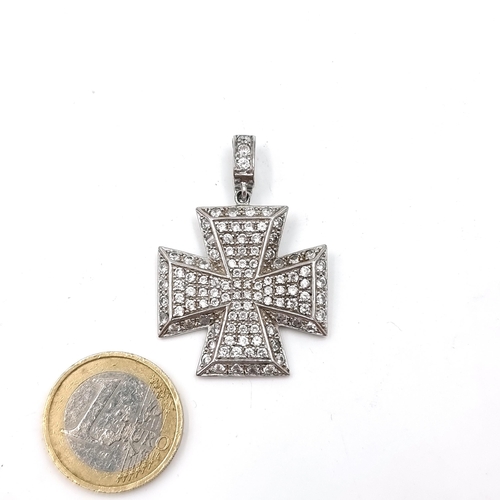 573 - A sterling silver mounted diamanté  cross pendant with gemstone detailing. Dimensions - 3 cms square... 