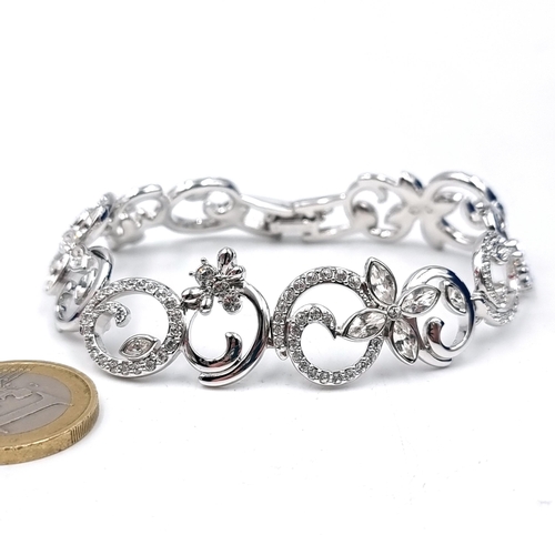 579 - An exquisite brand new Swarovski crystal bracelet set in a flower bloom design. Comes in original or... 