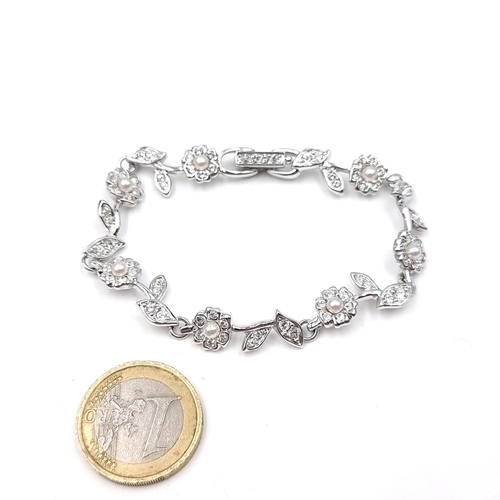 591 - A very pretty brand new Swarovski crystal bracelet set in a flower bloom design. Comes in original S... 