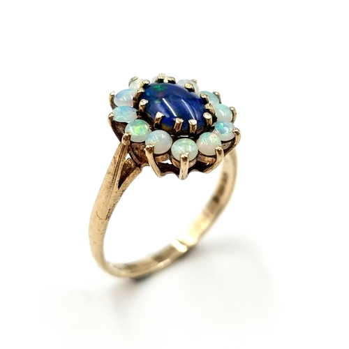 603 - Star Lot : An elaborate antique multi opal gemstone ring, With 11 fire opals and a beautiful large B... 