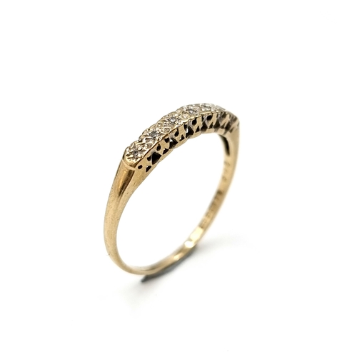 609 - An eye catching diamond ring set in nine carat gold. Stamped 375. Size O. Weight 1.16 grams. Boxed.