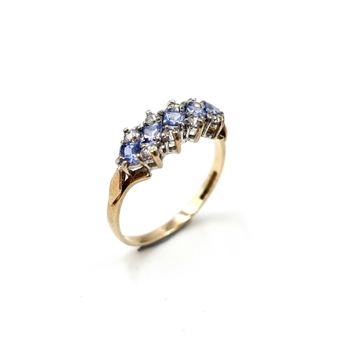 610 - Star Lot : A wonderful tanzanite and gemstone ring set in nine carat gold. Stamped 375. Size M. Weig... 