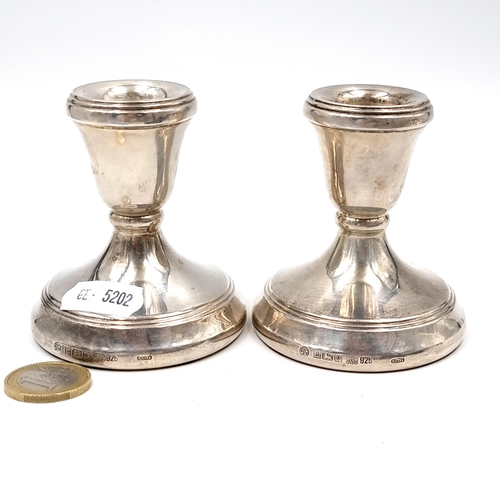 613 - A lovely pair of sterling silver candlesticks. Hallmarks for Birmingham. Bases filled. Total weight ... 