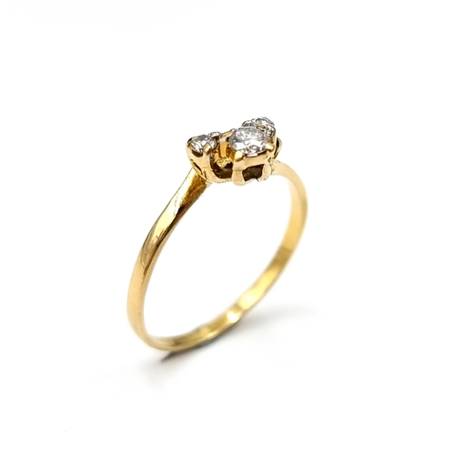 617 - An unusual graduated diamond ring set in 18 carat gold. Stamped 750 to band. Size I. Weight 1.64 gra... 