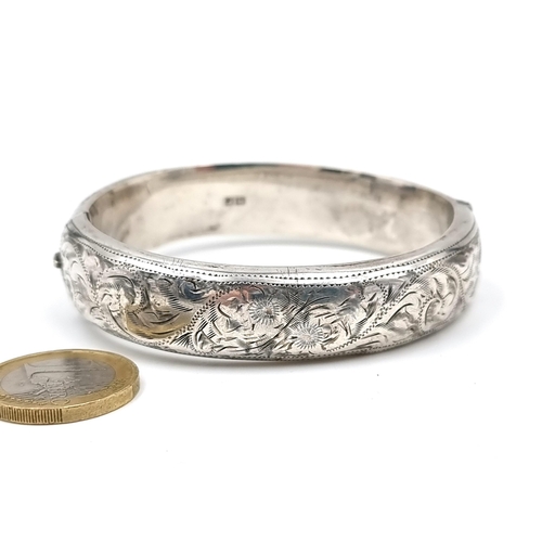 627 - A nice example of a sterling silver bangle set with foliette design hallmarked Birmingham circa 1955... 