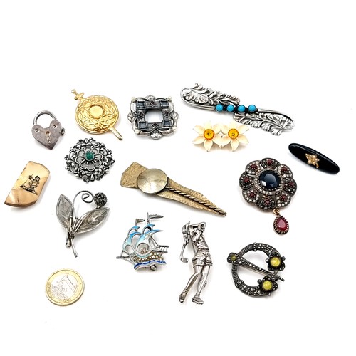 619 - A collection of 14 elaborate vintage brooches / tie pins including sterling silver examples, a Celti... 