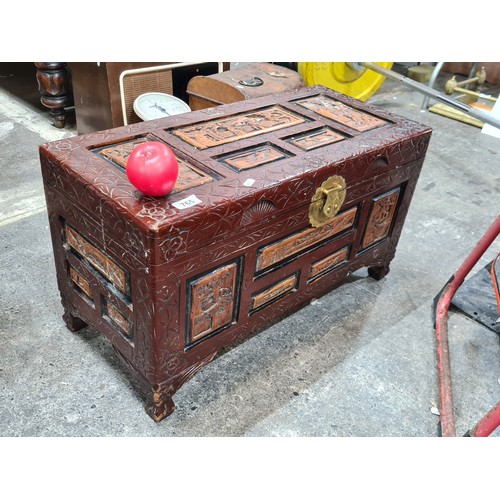 765 - A wonderful Chinese carved camphor wood chest with red lacquer.