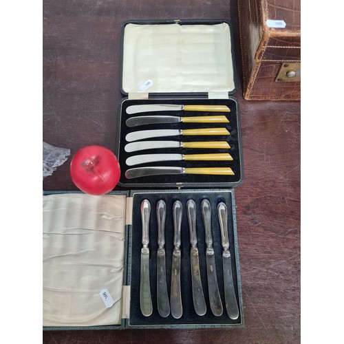 790 - Two very pretty sets of table knifes both contained in original presentation cases.