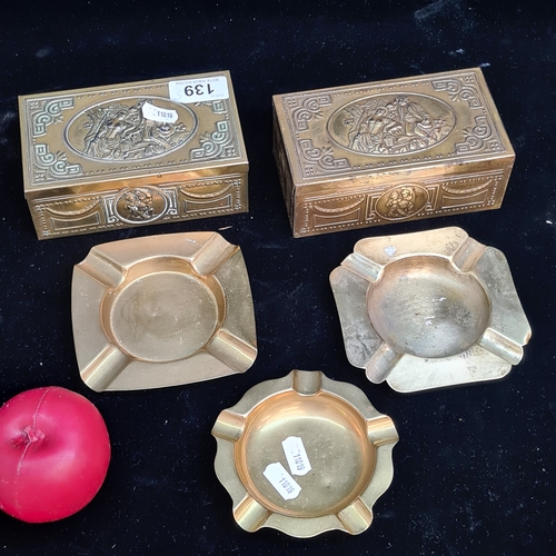 139 - Five vintage brass items including two lovely wooden lined embossed boxes with cherubs, along with t... 