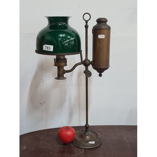 783 - A superb antique student lamp with original emerald green over opaque white cased glass shade with r... 