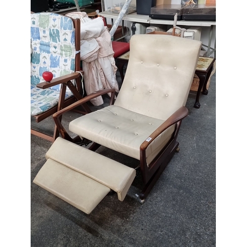 803 - Mid-Century Modern reclining chair with cream upholstery and wooden armrests, featuring a retractabl... 