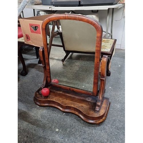 804 - Victorian mahogany vanity mirror with an elegant curvilinear base and adjustable frame. Finely detai... 