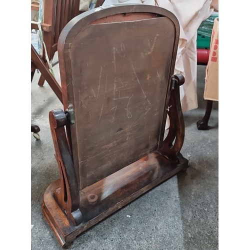 804 - Victorian mahogany vanity mirror with an elegant curvilinear base and adjustable frame. Finely detai... 