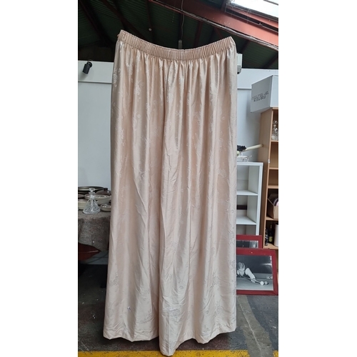 807 - Pair of good quality lined  beige damask curtains feature an elegant floral pattern and gathered ple... 