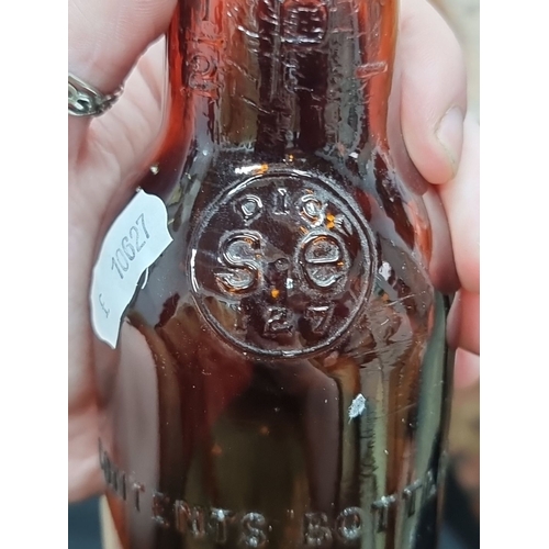 816 - Vintage J.B. Fitzgerald & Co. amber glass bottle alongside Corcoran's Mineral Waters Carlow jug, mar... 