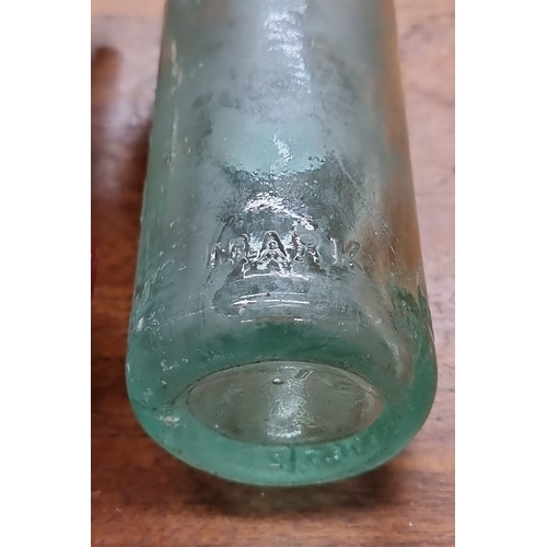 818 - Antique green glass bottle embossed with 