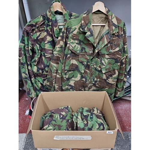 823 - Lot of combat jackets and trousers, including two smocks by Dashmore Clothing Ltd.