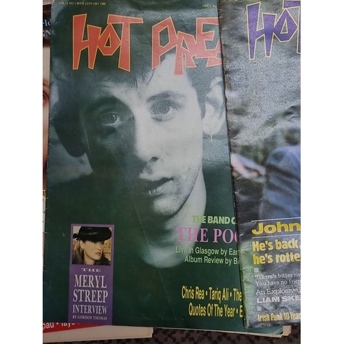 825 - Collection of vintage 'Hot Press' magazines from 1988, alongside an assortment of newspaper clipping... 