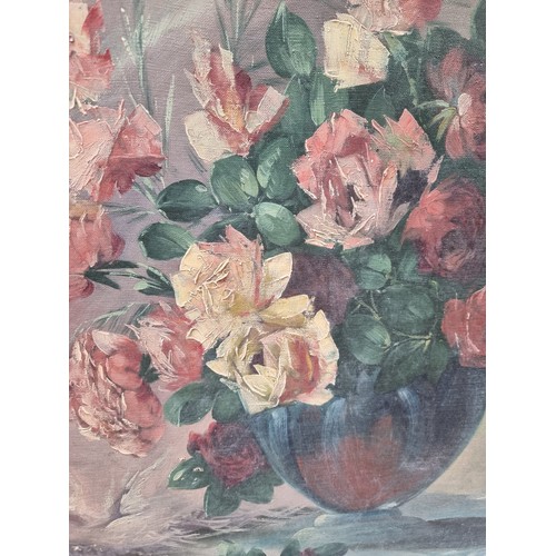 1370 - Star Lot : A large 1930's oil canvas painting featuring a still life of roses. Rendered in a loose s... 