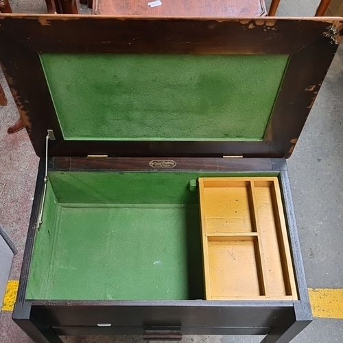 1377 - A vintage Chard Product sewing table, features a lift-top with green felt interior and integrated st... 