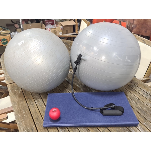 1393 - Two large exercise balls along with a foldable workout mat.
Previous in auction on 29/08/24 with Lot... 