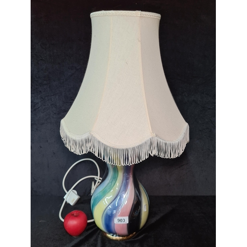 1409 - A highly vibrant ceramic table lamp. Slight crack to base.
Previous in auction on 29/08/24 with Lot ... 