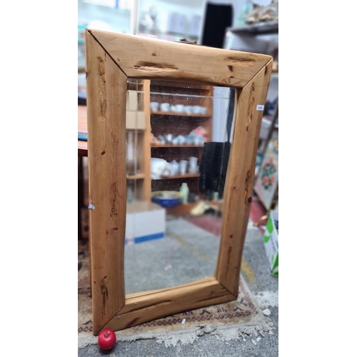 1424 - A large tall beveled wall / free standing mirror. Housed in a wooden frame.
MM: 71 x 117 cm includin... 