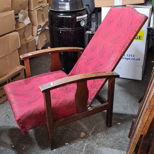 1431 - Pair of vintage oak armchairs with red floral upholstery, one convertible to a recliner. Mid-century... 