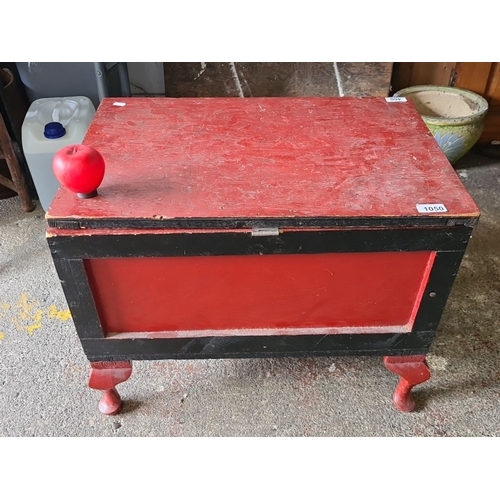 1441 - Vintage wood storage chest, painted red and black, features sturdy construction with an interior hin... 