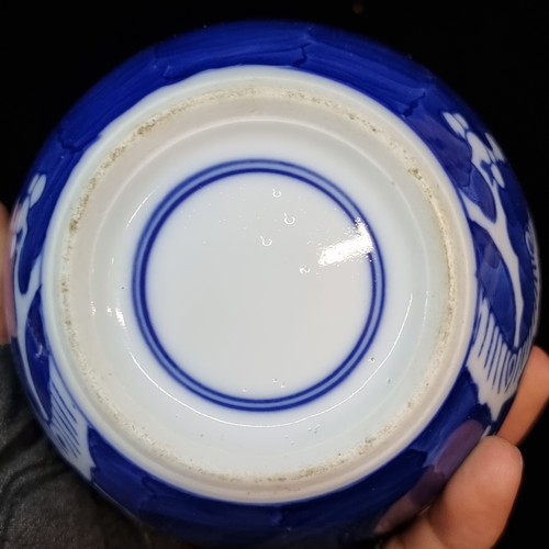 174 - Three vintage ceramic pieces all featuring blue and white prunus patterns. Includes two ginger jars ... 