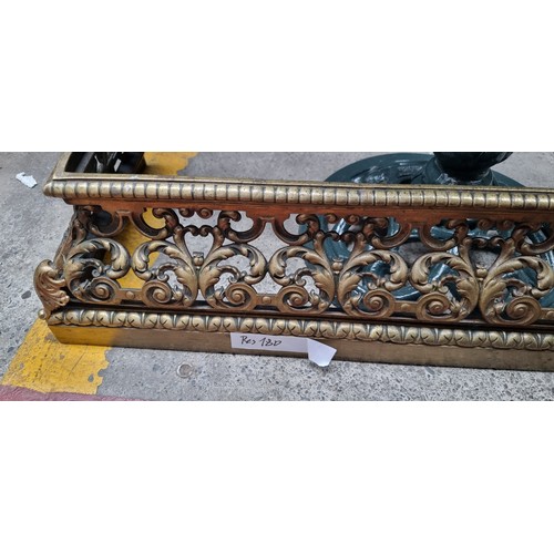 392 - Star Lot : A stunning pierced brass fire fender with intricate agapanthus leaf scrollwork throughout... 