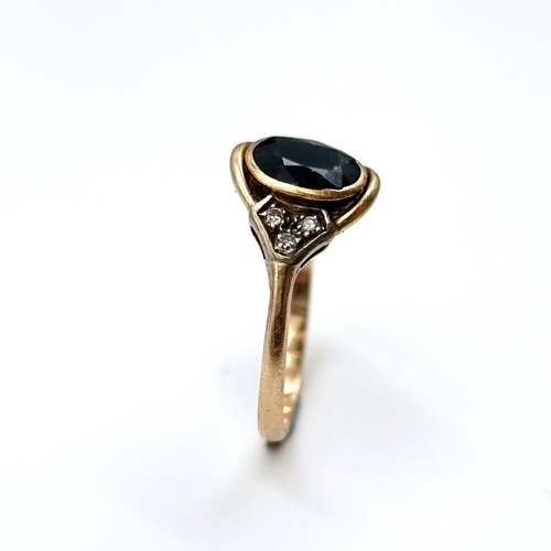 5 - Star Lot : A lovely antique oval facet black onyx ring with diamond shoulders set in 14 carat gold. ... 