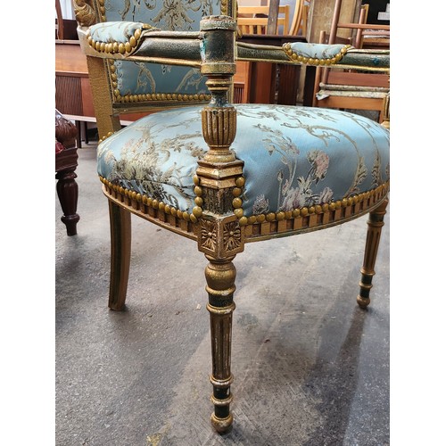 484 - Star Lot : An amazing Pair of French carved and gilded Parlour chairs with intricate floral upholste... 