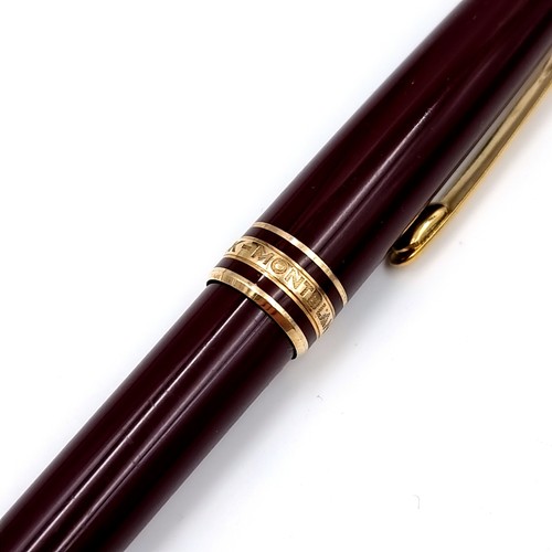 16 - Star lot : An excellent Mont Blanc Meisterstuck ball point writing pen in a gold toned and burgundy ... 