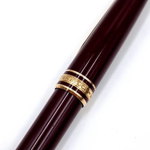 16 - Star lot : An excellent Mont Blanc Meisterstuck ball point writing pen in a gold toned and burgundy ... 