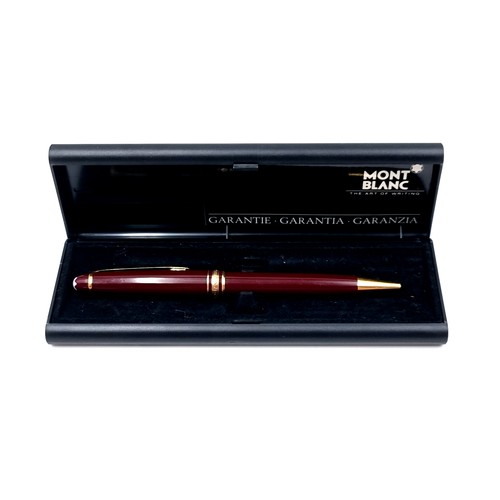 16 - Star lot : An excellent Mont Blanc Meisterstuck ball point writing pen in a gold toned and burgundy ... 