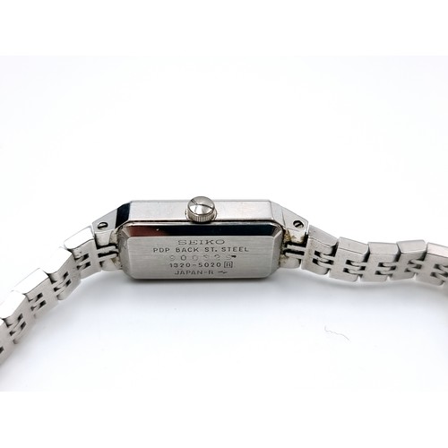 17 - A SEIKO Quartz stainless steel wrist watch. No. 900329. Housed in original SEIKO branded watch box.